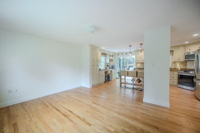 61 Wright Rd, Ayer, MA 01432 - unfurnished living room featuring light wood-style flooring and recessed lighting