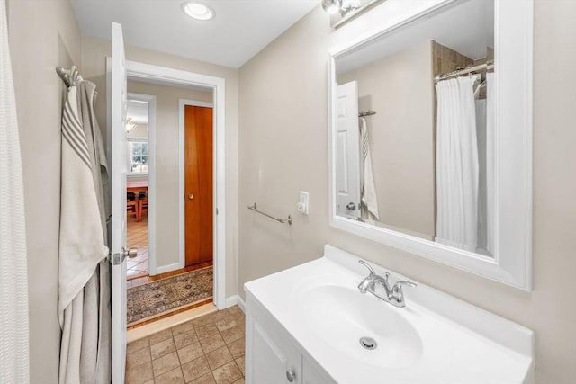 bathroom with vanity and curtained shower