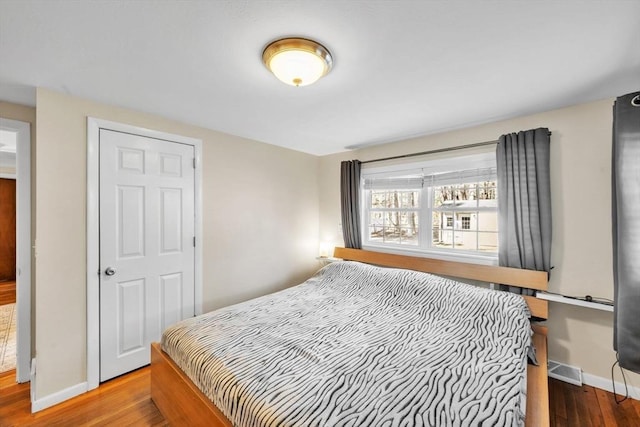 bedroom with wood-type flooring