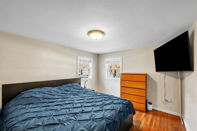 bedroom featuring wood-type flooring