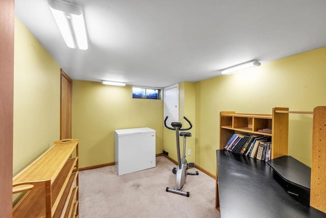 exercise room with light carpet