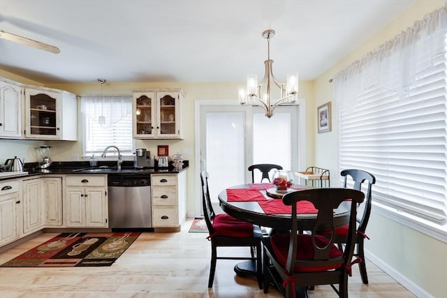 1051 Elm St Unit 8, West Springfield, MA 01089 - dining area featuring a chandelier and light wood-type flooring