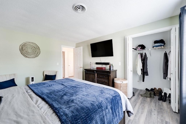 1051 Elm St Unit 8, West Springfield, MA 01089 - bedroom with wood finished floors, a closet, and a textured ceiling