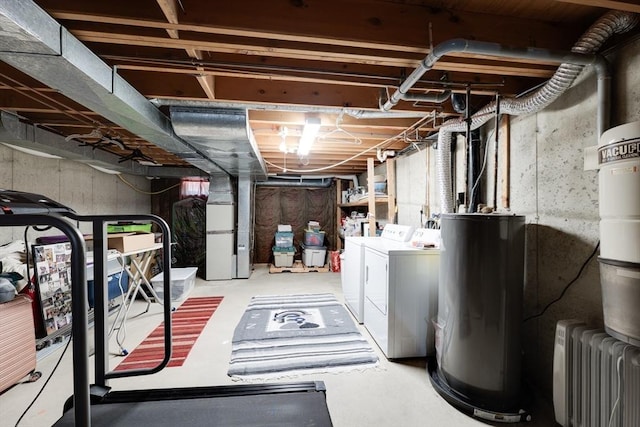 1051 Elm St Unit 8, West Springfield, MA 01089 - unfinished below grade area featuring water heater, radiator heating unit, and washing machine and clothes dryer