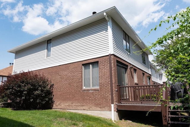 1051 Elm St Unit 8, West Springfield, MA 01089 - view of home's exterior featuring brick siding and a deck