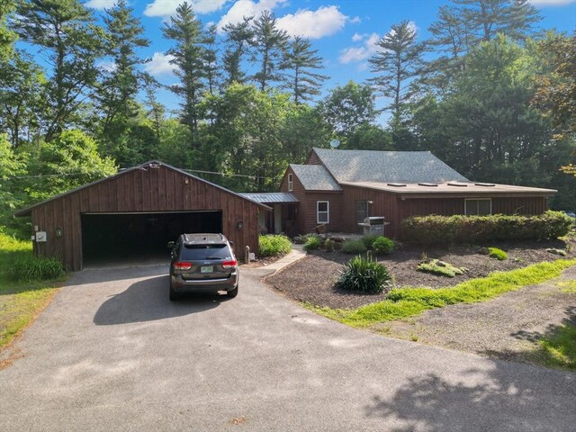 2 Tenney Ct, Georgetown, MA 01833 - view of front of property featuring a garage and asphalt driveway