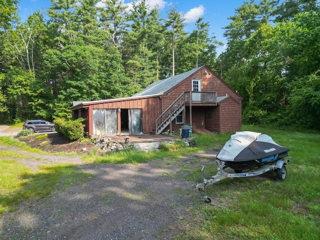 2 Tenney Ct, Georgetown, MA 01833 - view of outbuilding with stairs and a view of trees