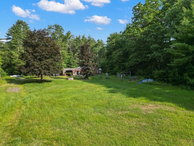 2 Tenney Ct, Georgetown, MA 01833 - view of grassy yard with a forest view