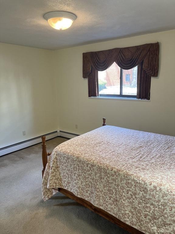 20 Colonial Dr Unit 3, Andover, MA 01810 - bedroom featuring dark colored carpet