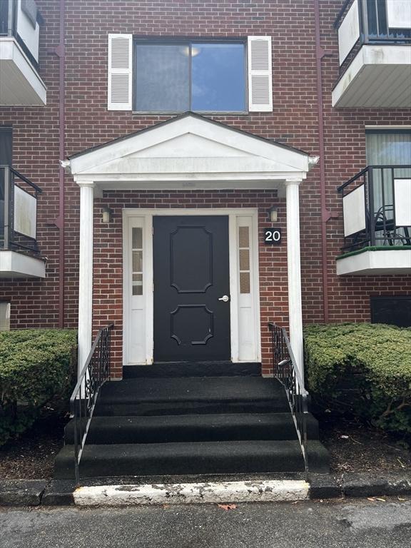 20 Colonial Dr Unit 3, Andover, MA 01810 - property entrance featuring brick siding