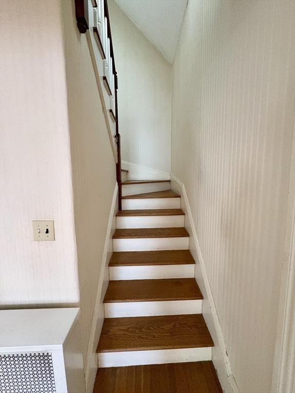 staircase with lofted ceiling