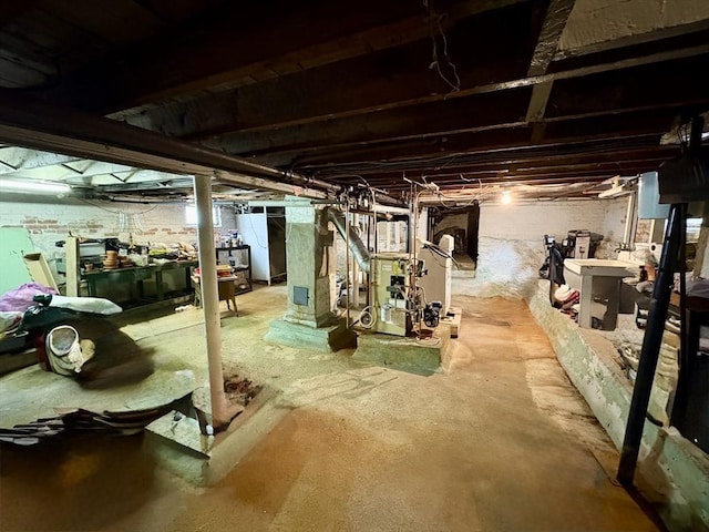 unfinished basement with a heating unit