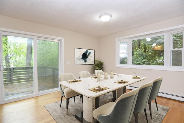 154 E Bacon St Unit B6, Plainville, MA 02762 - dining space with plenty of natural light, baseboard heating, and light wood-style flooring