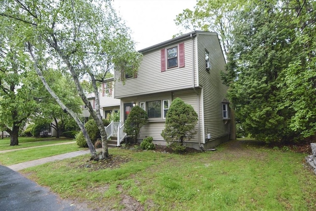 154 E Bacon St Unit B6, Plainville, MA 02762 - view of front facade with a front yard