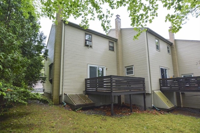 154 E Bacon St Unit B6, Plainville, MA 02762 - back of property featuring a wooden deck, a chimney, and a lawn