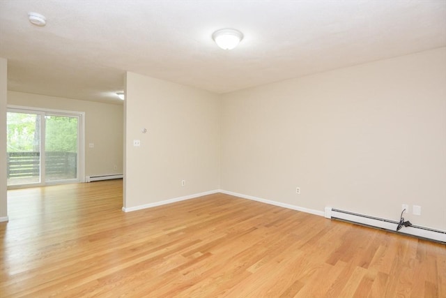 154 E Bacon St Unit B6, Plainville, MA 02762 - empty room featuring light wood finished floors, baseboard heating, a smoke detector, and baseboards