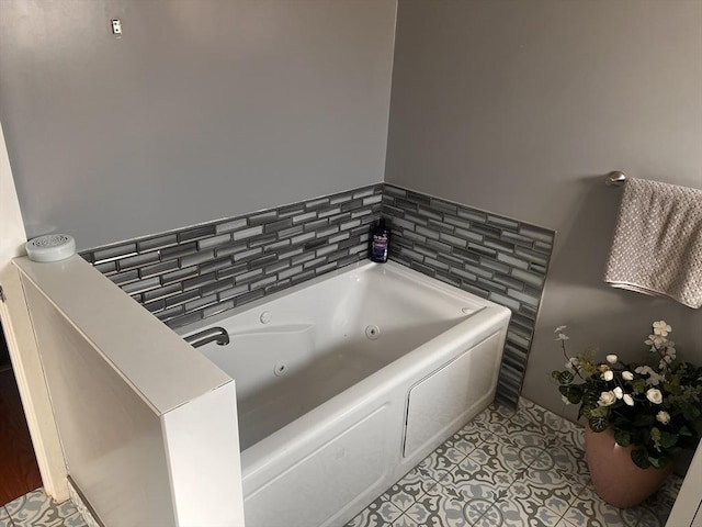 bathroom featuring tile patterned flooring and a tub