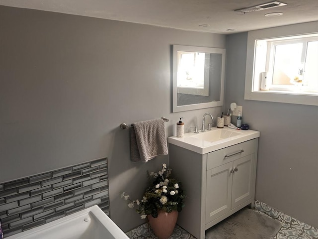 bathroom with vanity and plenty of natural light