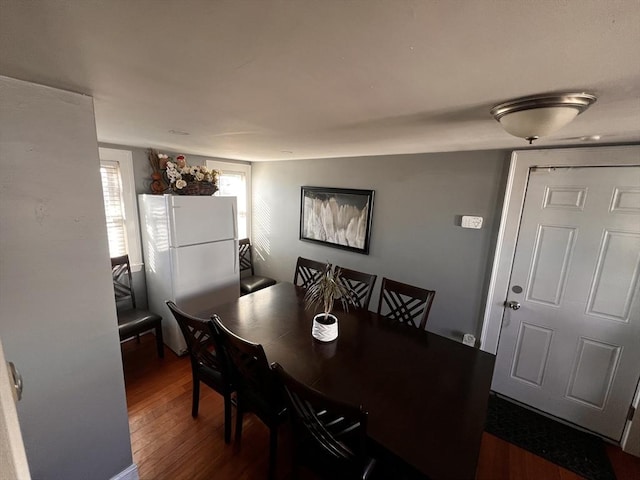 dining space featuring dark hardwood / wood-style floors