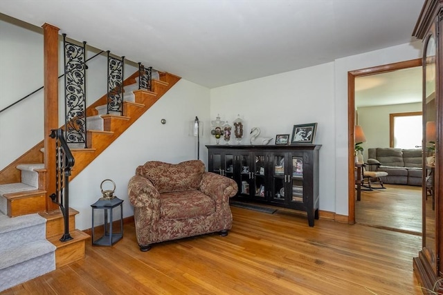 21 Alfred St, Woburn, MA 01801 - sitting room featuring light wood-type flooring, baseboards, and stairs