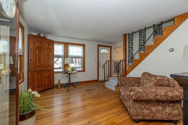 21 Alfred St, Woburn, MA 01801 - foyer featuring light wood finished floors, stairway, and baseboards