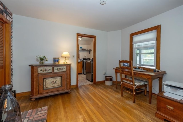 21 Alfred St, Woburn, MA 01801 - office area featuring washing machine and clothes dryer, hardwood / wood-style flooring, and baseboards