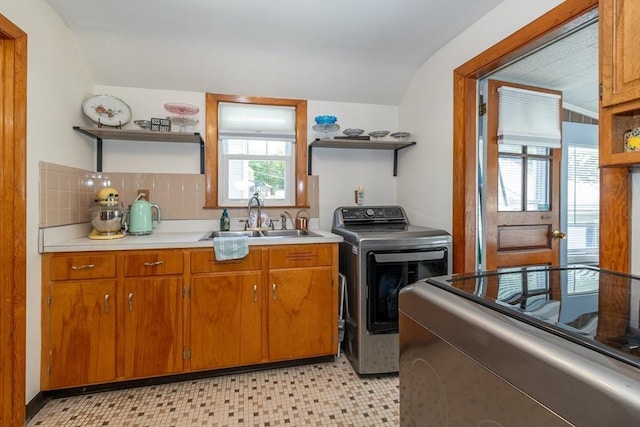 21 Alfred St, Woburn, MA 01801 - laundry area featuring washer / dryer, plenty of natural light, cabinet space, and light floors