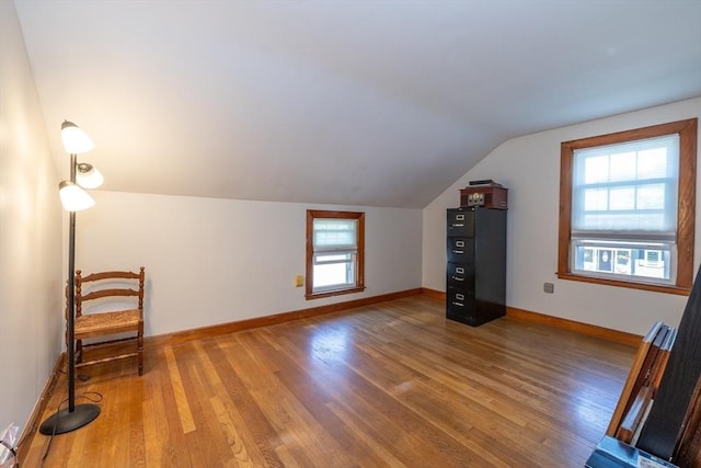 21 Alfred St, Woburn, MA 01801 - additional living space with light wood finished floors, lofted ceiling, and baseboards