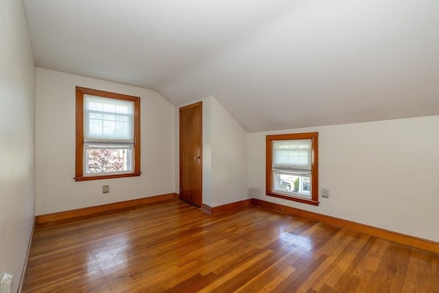 21 Alfred St, Woburn, MA 01801 - additional living space with lofted ceiling, wood finished floors, and baseboards