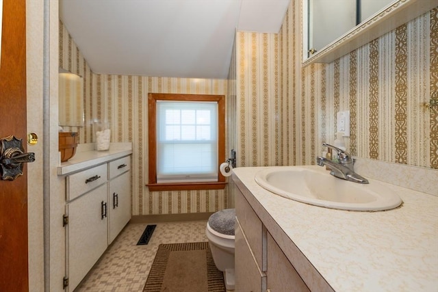 21 Alfred St, Woburn, MA 01801 - bathroom featuring vanity, toilet, and wallpapered walls