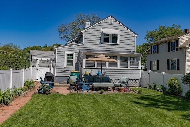 21 Alfred St, Woburn, MA 01801 - rear view of property featuring an outdoor hangout area, a patio area, a chimney, and a sunroom