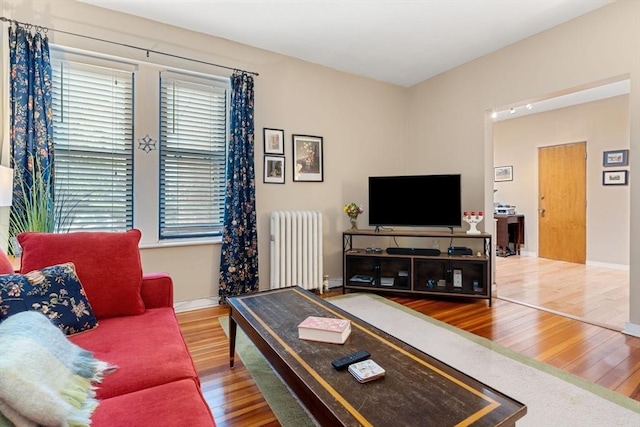 1404 Commonwealth Ave Unit 4-8, Boston, MA 02135 - living room with radiator and wood finished floors