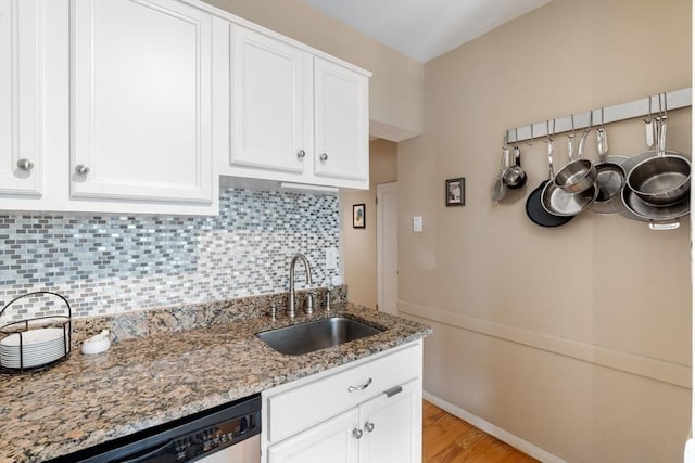 1404 Commonwealth Ave Unit 4-8, Boston, MA 02135 - kitchen with dishwasher, white cabinetry, light wood-type flooring, and backsplash