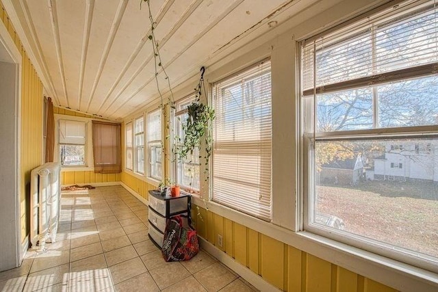 unfurnished sunroom featuring wooden ceiling