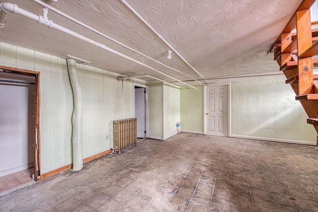 finished basement featuring baseboards