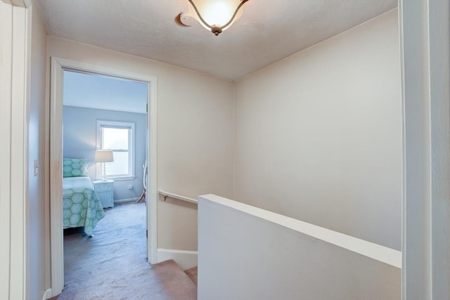 112 Olde Colonial Dr Unit 3, Gardner, MA 01440 - hall featuring an upstairs landing, light colored carpet, and baseboards