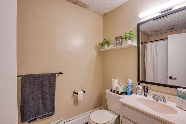 bathroom featuring vanity, toilet, and a textured ceiling