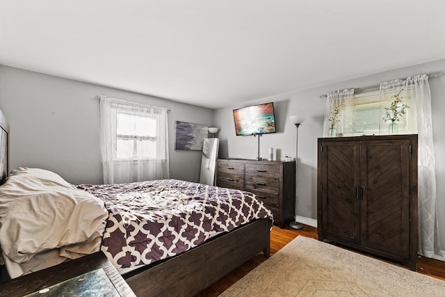 bedroom with hardwood / wood-style flooring