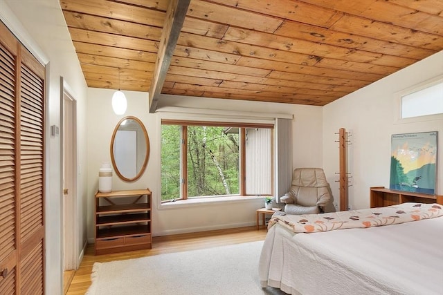77 Temple Rd, Concord, MA 01742 - bedroom featuring wood ceiling, wood finished floors, baseboards, beam ceiling, and a closet