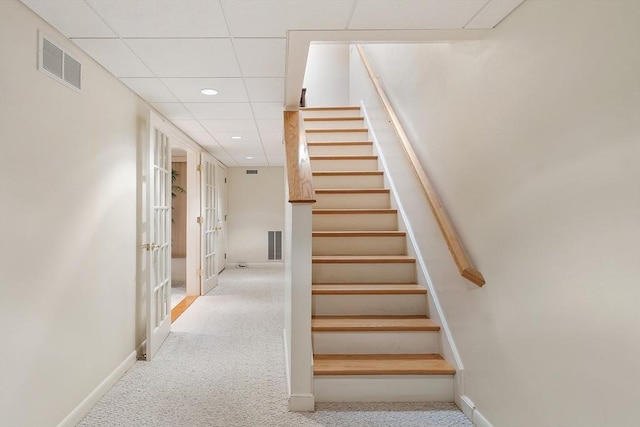 77 Temple Rd, Concord, MA 01742 - stairway featuring carpet flooring, baseboards, french doors, recessed lighting, and a paneled ceiling