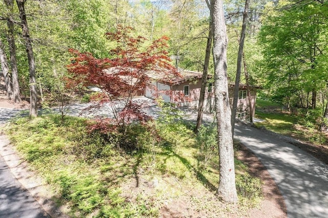 77 Temple Rd, Concord, MA 01742 - view of front of home with a forest view