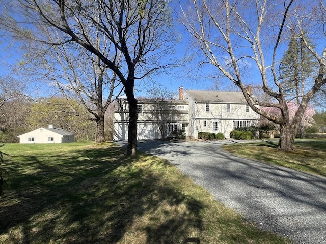 10 Ward Ln, Sherborn, MA 01770 - view of front of house with driveway, a chimney, and a front yard