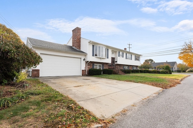 view of front facade with a garage and a front yard