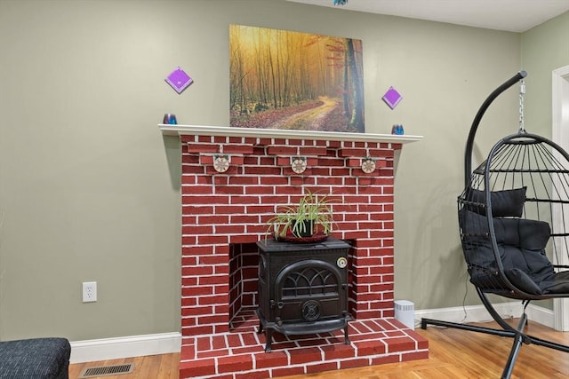 19 Shaker Ln, Littleton, MA 01460 - detailed view of a wood stove and wood finished floors