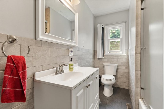 19 Shaker Ln, Littleton, MA 01460 - full bathroom featuring tile patterned floors, tile walls, vanity, an enclosed shower, and wainscoting