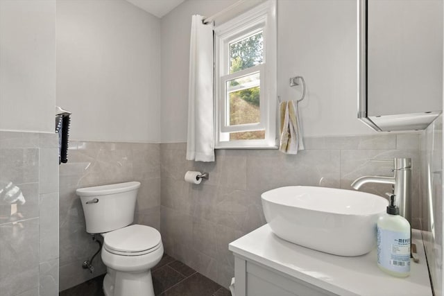 19 Shaker Ln, Littleton, MA 01460 - bathroom featuring tile walls, a wainscoted wall, vanity, and tile patterned flooring
