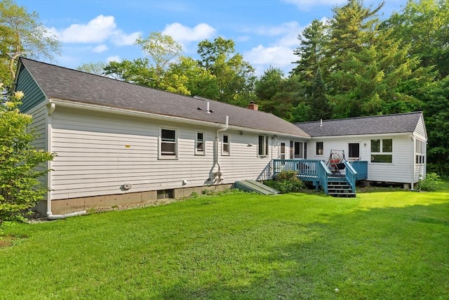 19 Shaker Ln, Littleton, MA 01460 - rear view of house with a wooden deck and a lawn