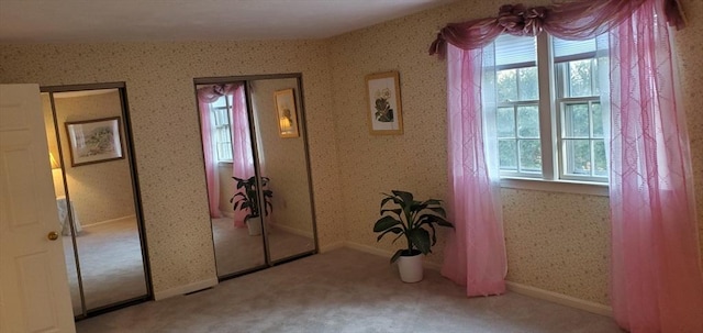 corridor with carpet flooring
