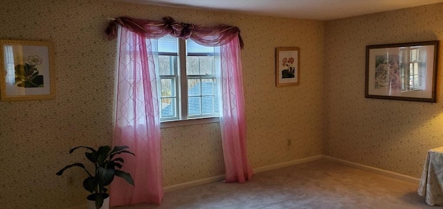 unfurnished room featuring carpet