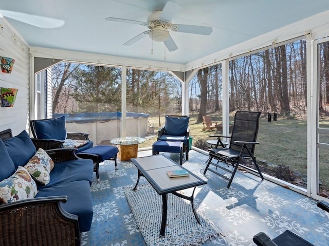sunroom / solarium with ceiling fan and outdoor lounge area